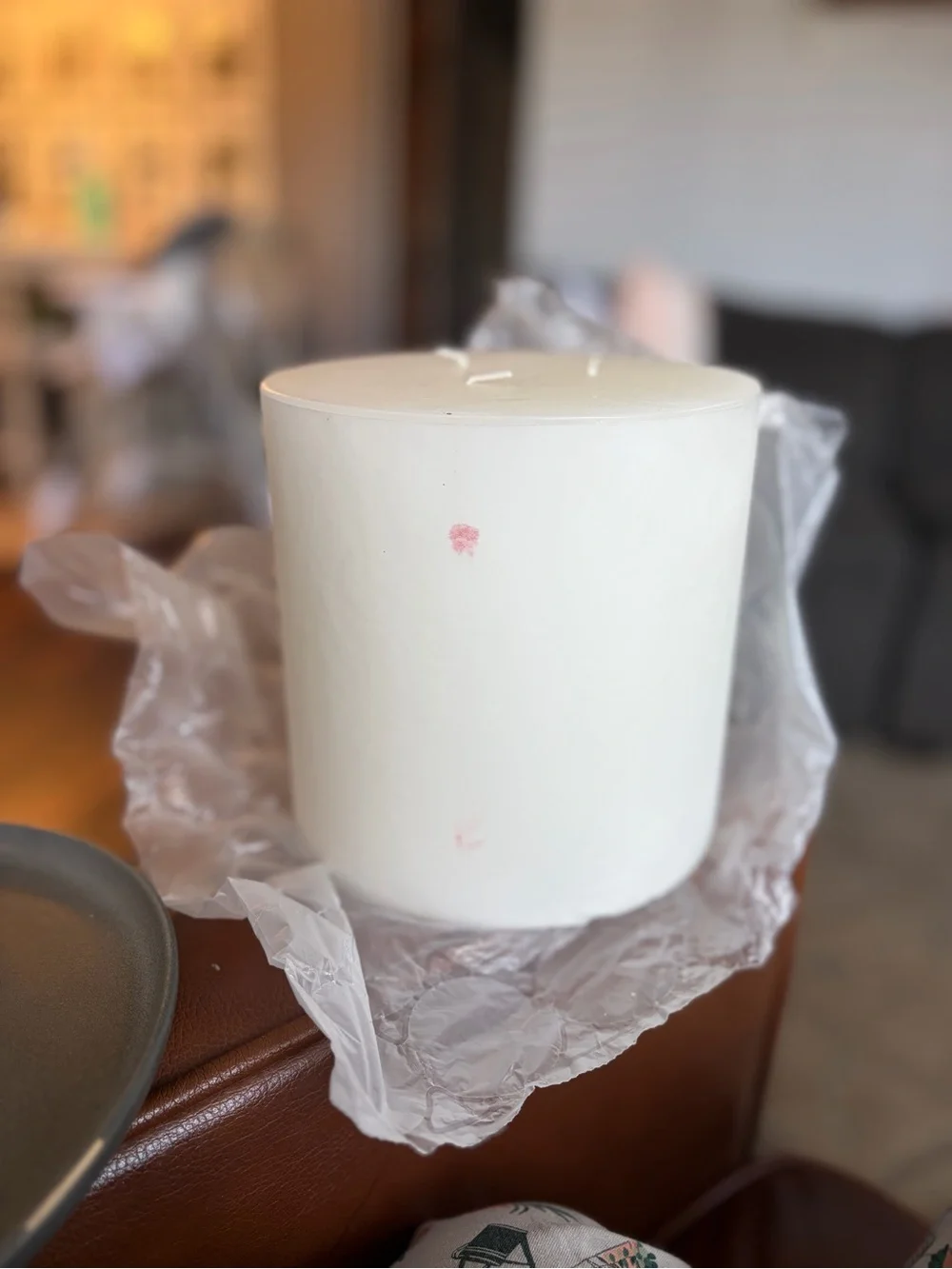 Crate&Barrel Matte Gray Stoneware Charger with Natural Rim and White candle